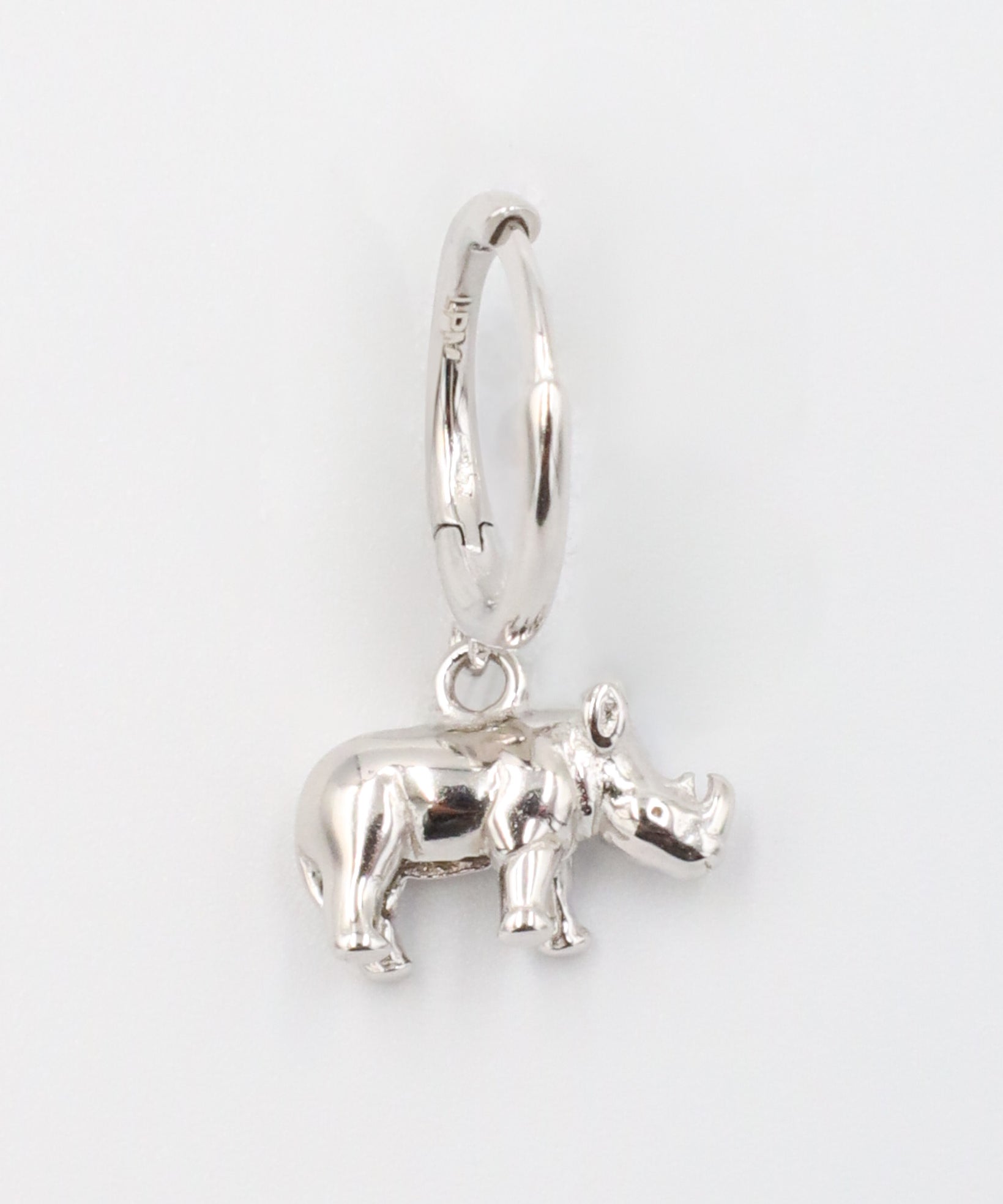 Sterling silver rhino hoop earring for the right ear.