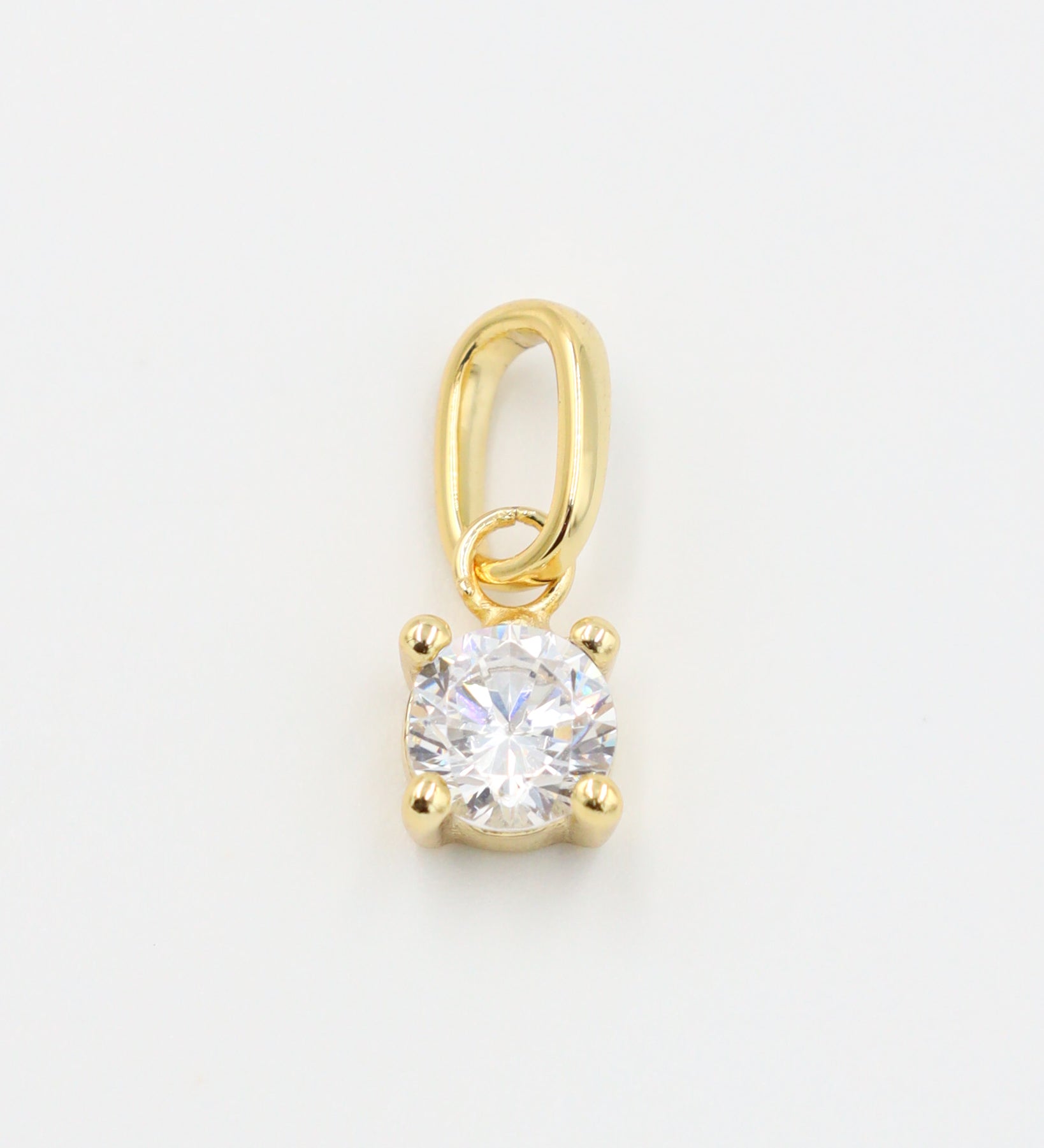 Close-up of Riley Gold Pendant with a zirconia stone set in gold-plated 925 sterling silver.