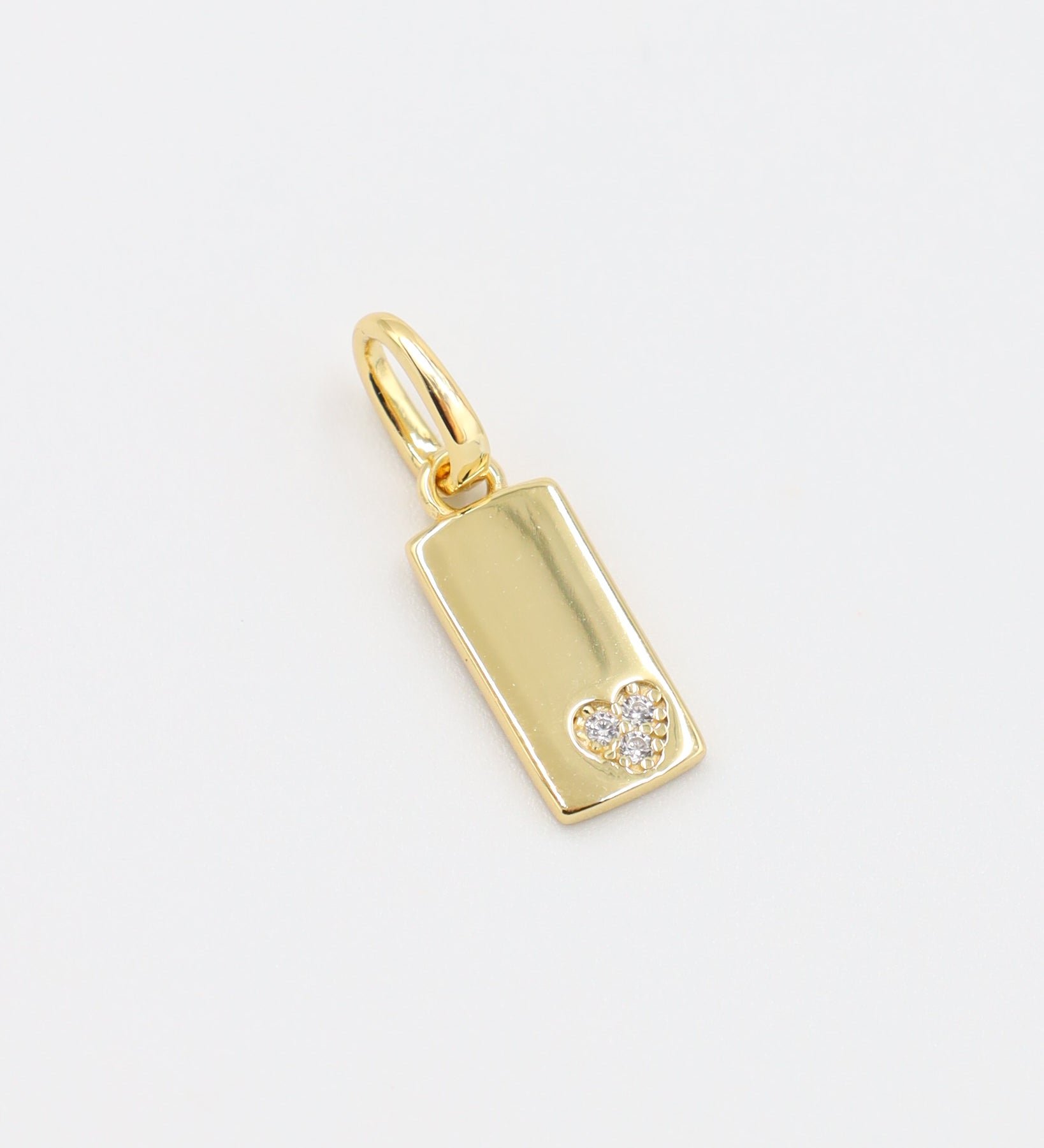 Sophia Gold Pendant - Front view of the rectangular gold-plated pendant featuring a small zirconia heart.
