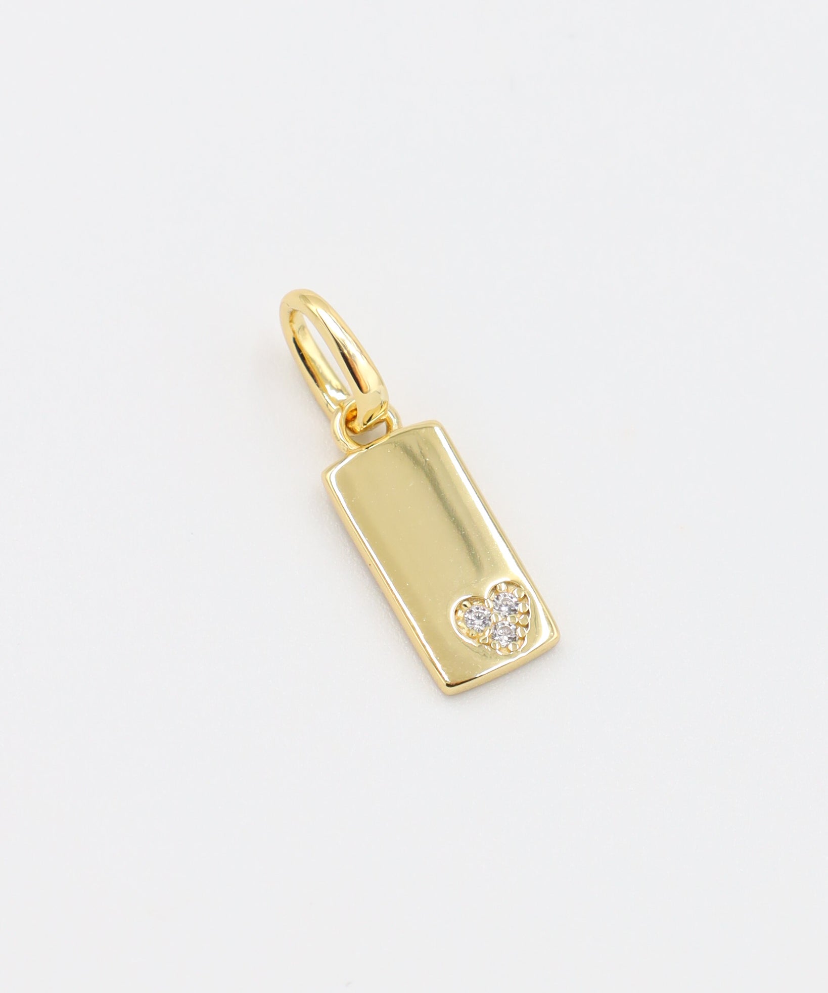 Sophia Gold Pendant - Front view of the rectangular gold-plated pendant featuring a small zirconia heart.