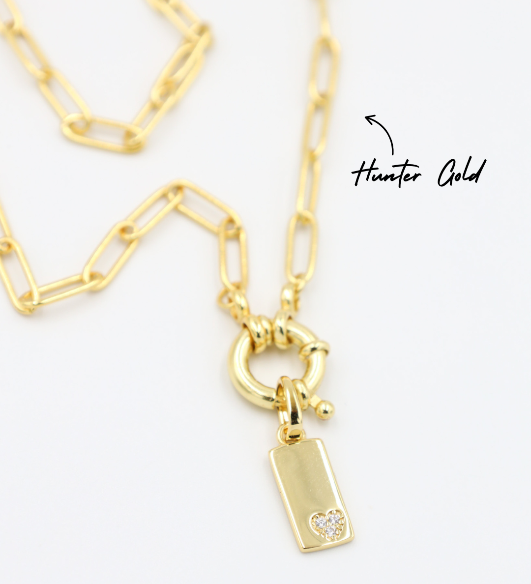 Sophia Gold Pendant with Chain - A gold-plated rectangular pendant attached to a chain, showcasing the small zirconia heart.