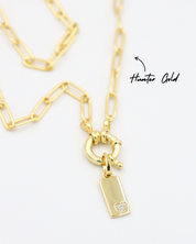 Sophia Gold Pendant with Chain - A gold-plated rectangular pendant attached to a chain, showcasing the small zirconia heart.