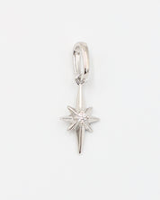 Close-up of a rhodium plated 925 sterling silver star pendant with a zirconia stone.