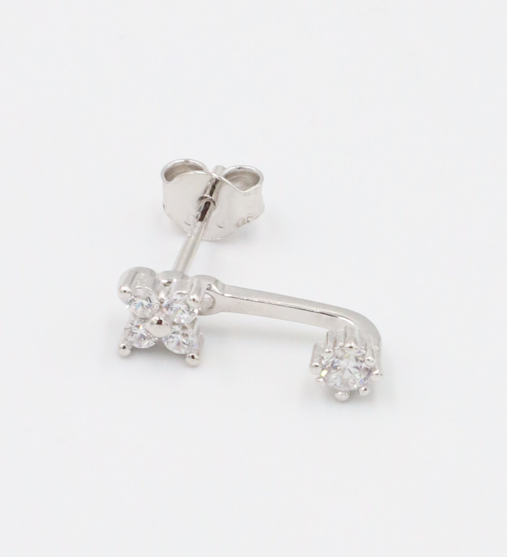 Sterling silver stud earring for the left ear with sparkling zirconia stones.