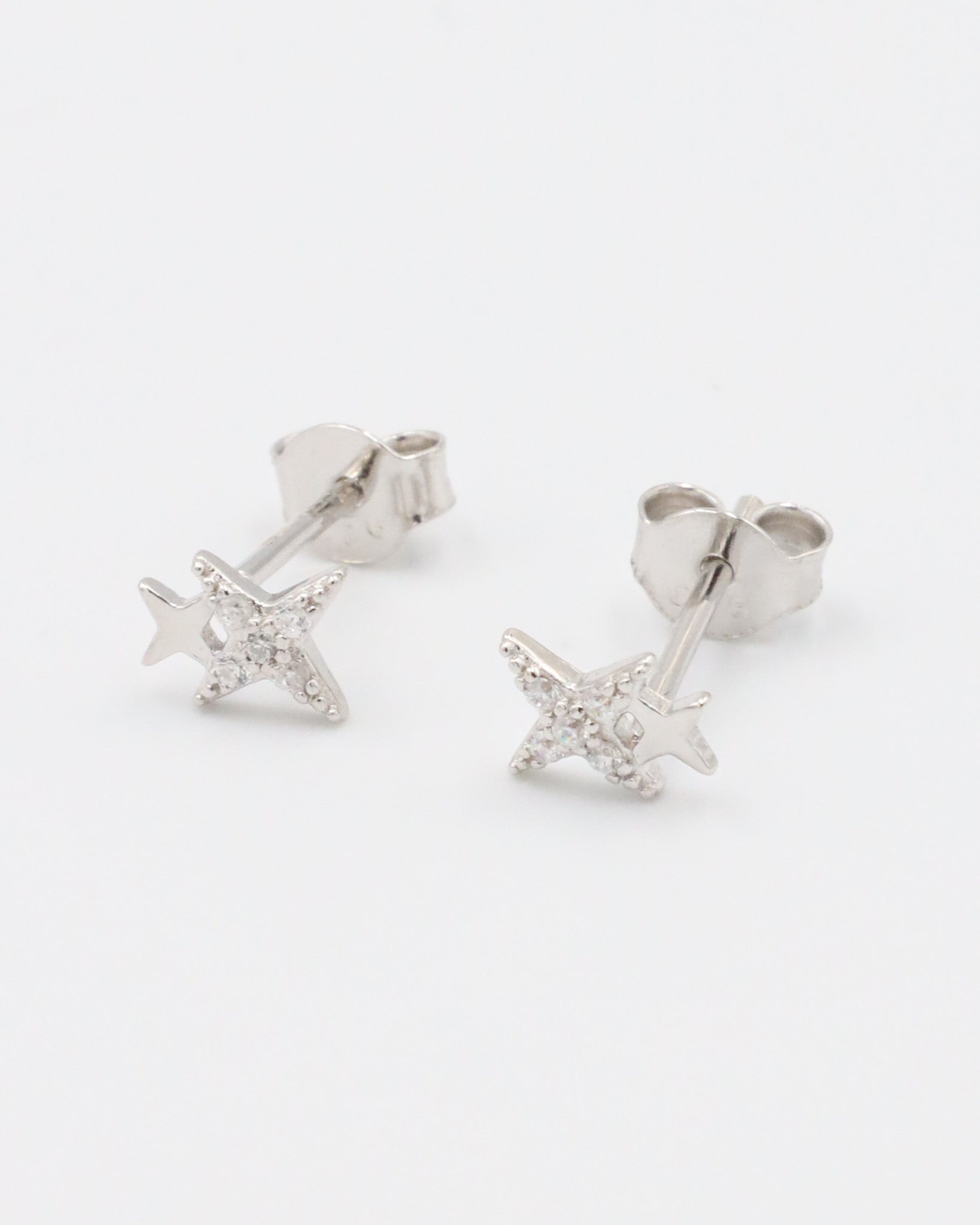 Pair of sterling silver Estelle stud earrings in a star design with sparkling zirconia stones.