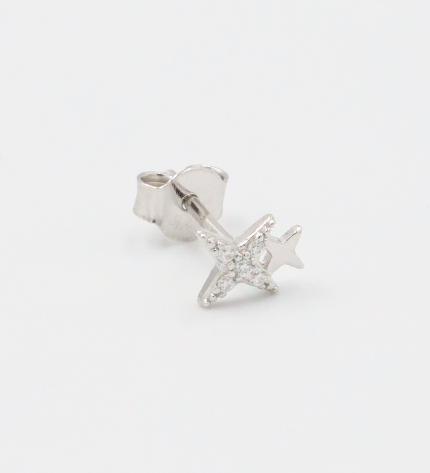 Single sterling silver Estelle stud earring in a star design with sparkling zirconia stones.