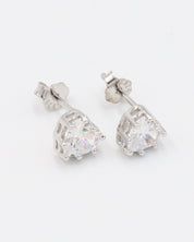 Angled view of a pair of sterling silver Romeo stud earrings with zirconia stones.