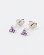 A pair of Vivian Lavender earrings in sterling silver, featuring three zirconia stones in a delicate lavender hue, designed as stud earrings.