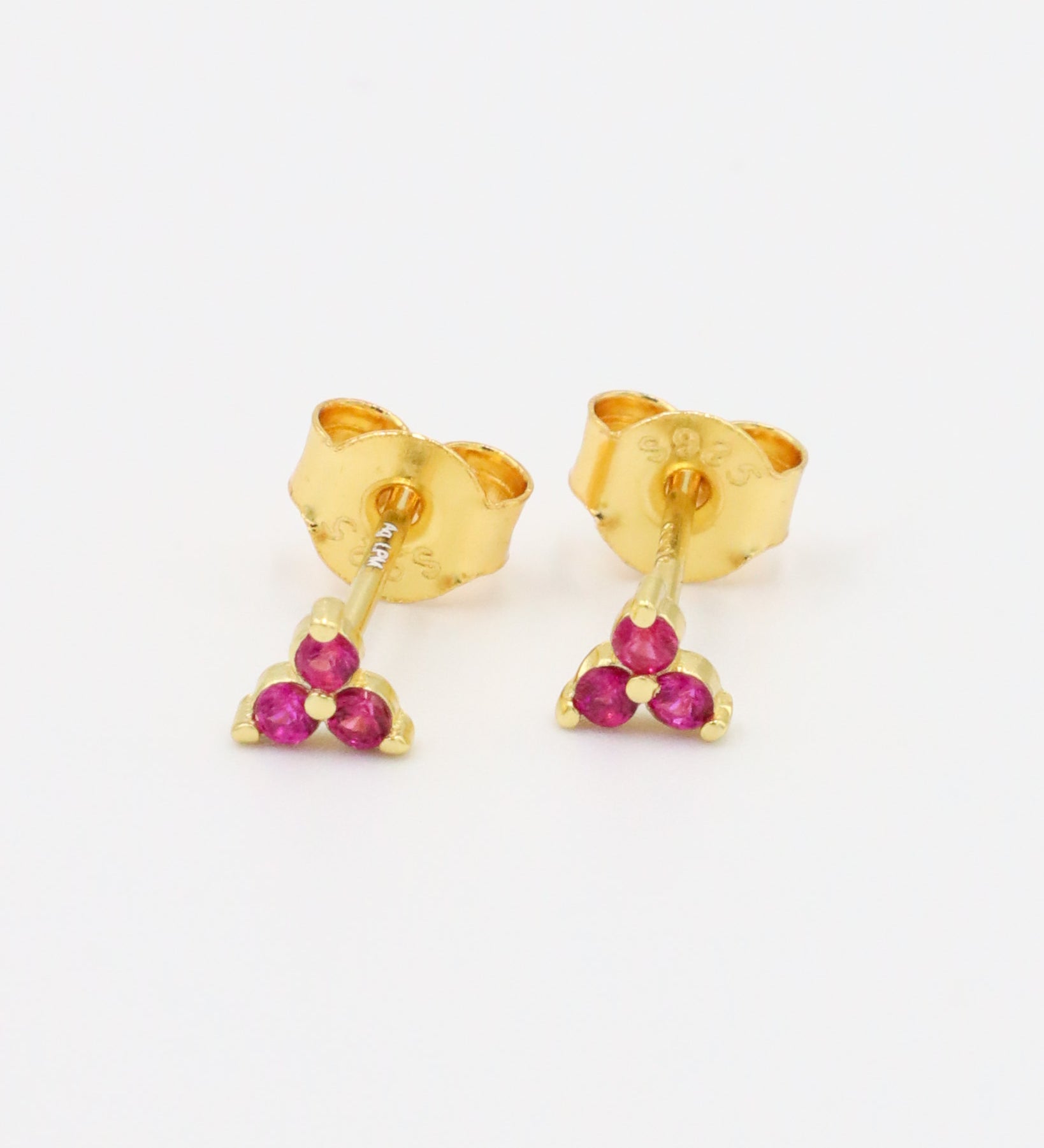 A pair of Vivian Pink stud earrings made from gold-plated 925 sterling silver with pink zirconia stones in a triangular cluster design.