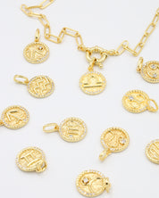 Gold-plated sterling silver zodiac pendants with sparkling zirconia stones arranged with a matching gold chain for a mix-and-match styling option.