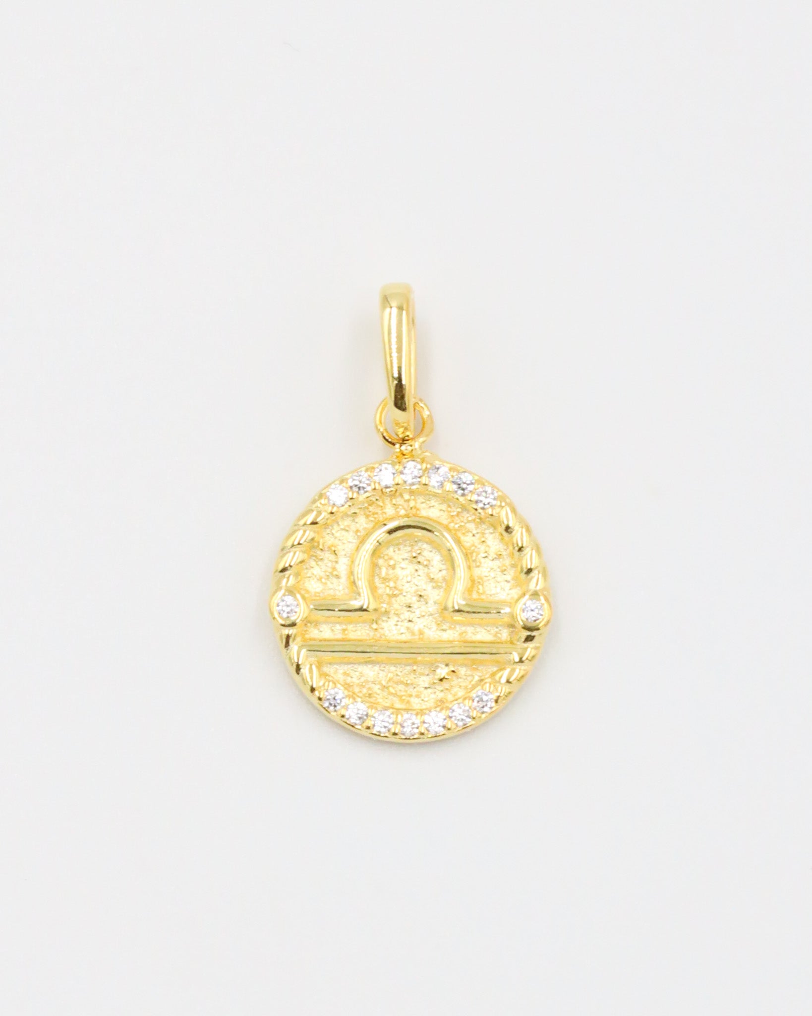 Gold-plated sterling silver Libra zodiac pendant with sparkling zirconia stones.