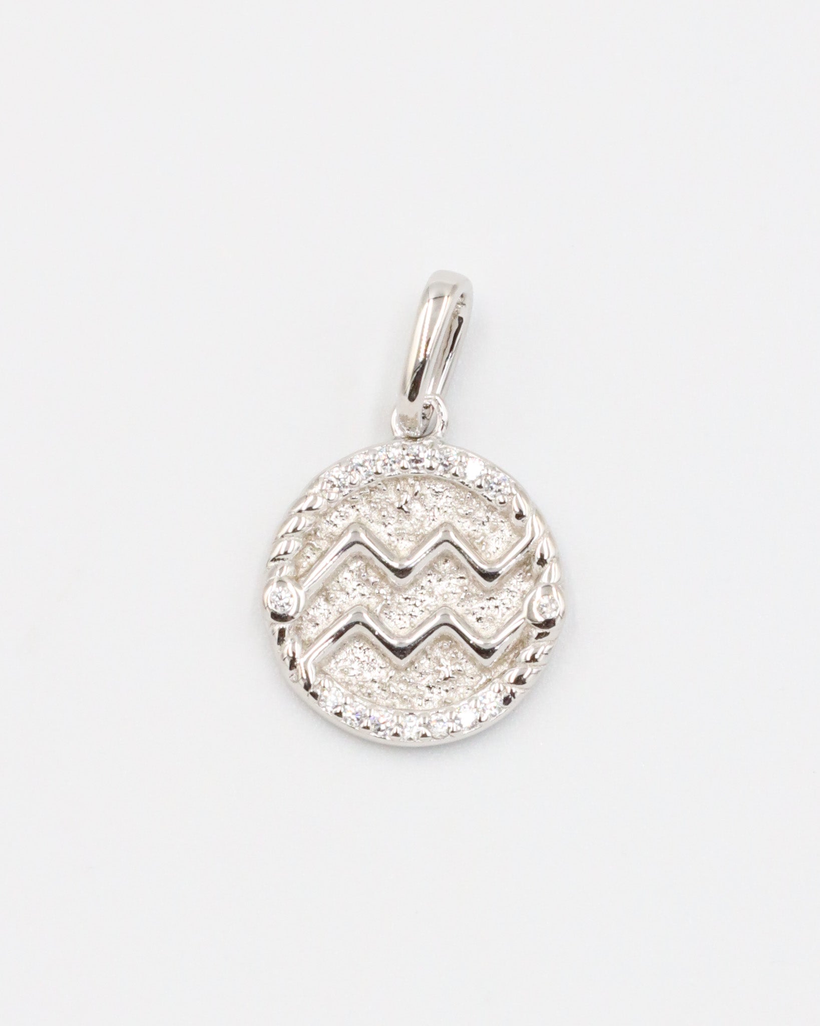 Aquarius zodiac silver pendant in rhodium-plated sterling silver featuring an elegant design and zirconia stone.